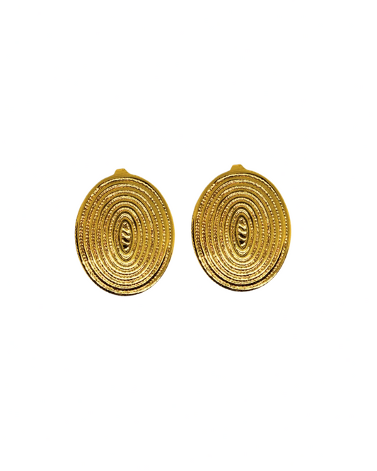 Pair of gold spiral earrings on a white background