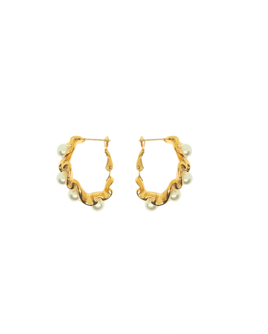 Gold hoop earrings with pearl accents on a white background