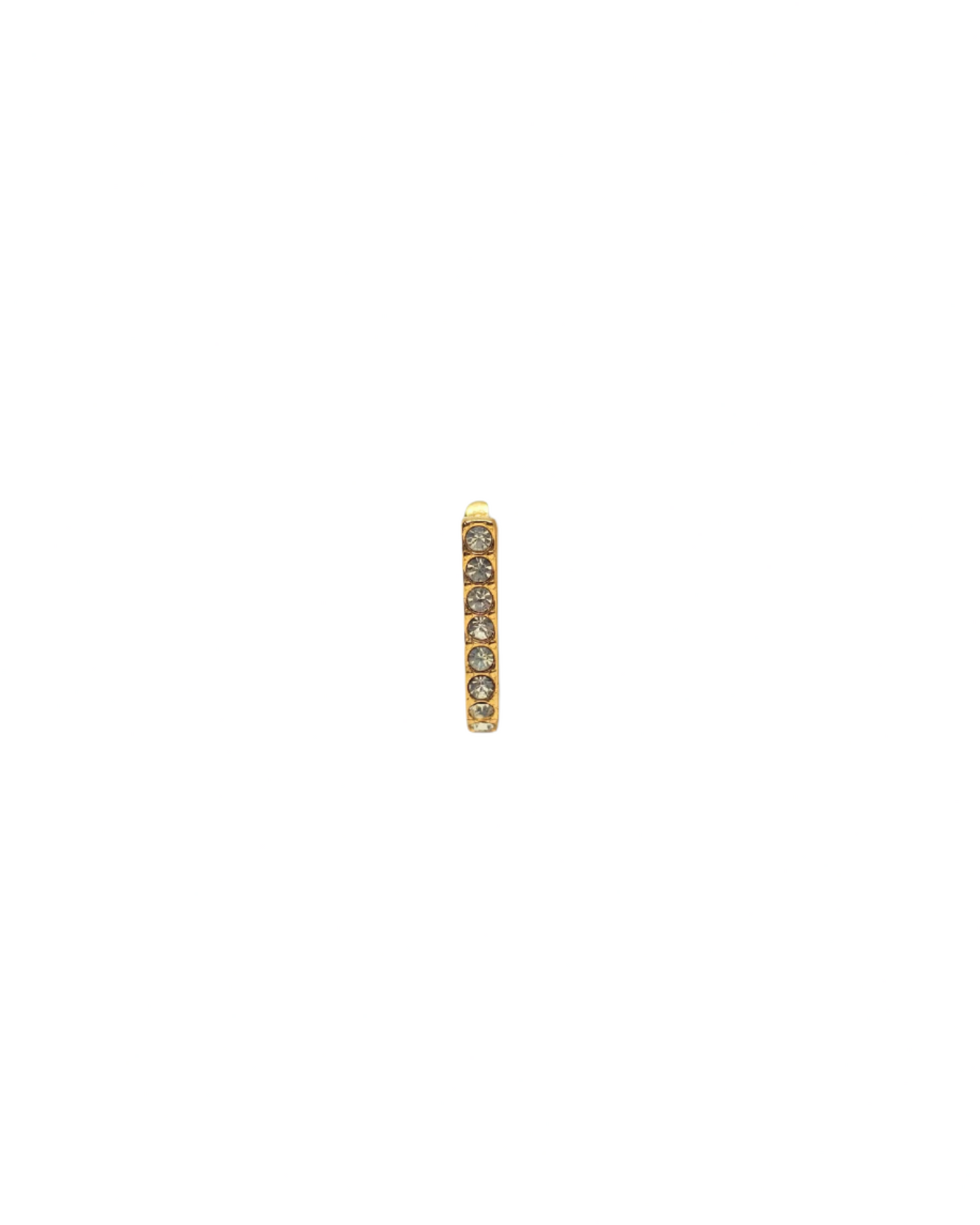 Gold earring with embedded stones on a white background