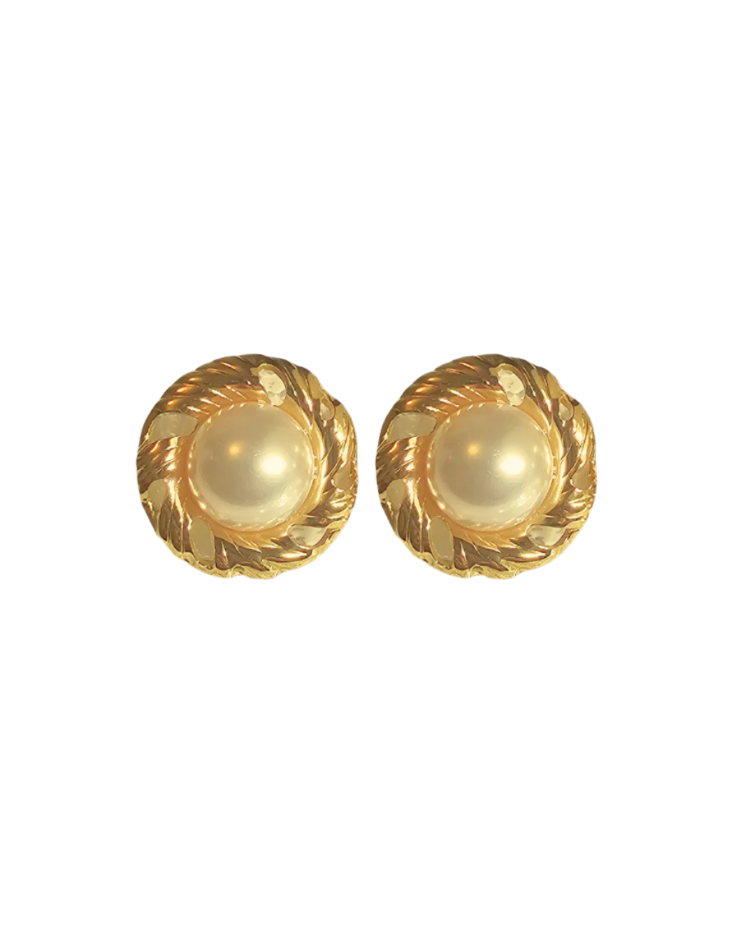 Pair of gold earrings with pearl-like centers on a white background