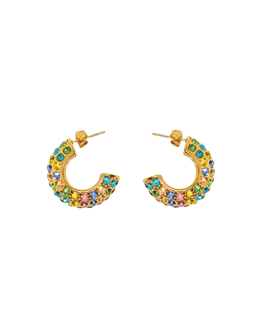 Colorful hoop earrings with gemstones on a white background
