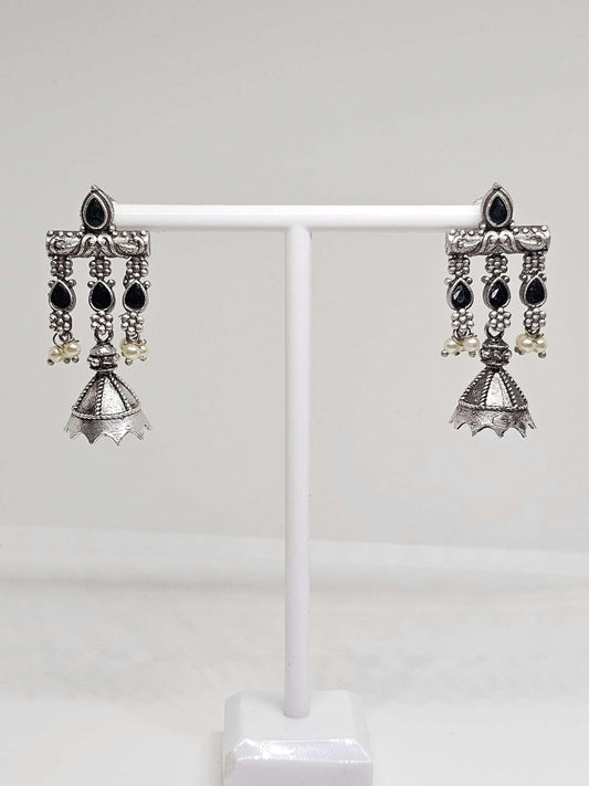 Oxidised silver earrings with black stones and white pearls, featuring a petite Jhumka Jhumki design, perfect for traditional and modern styles.