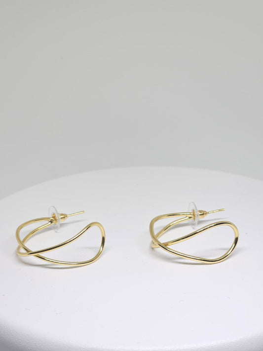 Close-up of Minimalist Gold Wave Hoop Earrings with unique wave shape