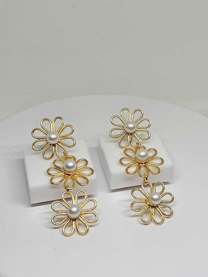 exquisite gold flower earrings with shiny pearl centers, combining elegance with a delicate floral design, making them a versatile accessory for any jewelry collection.