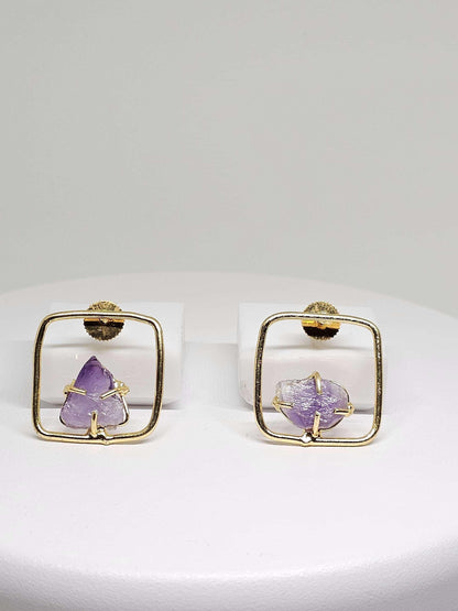 Handcrafted brass earrings with raw amethyst stones, combining bohemian charm and modern geometric design, ideal for women’s statement jewelry