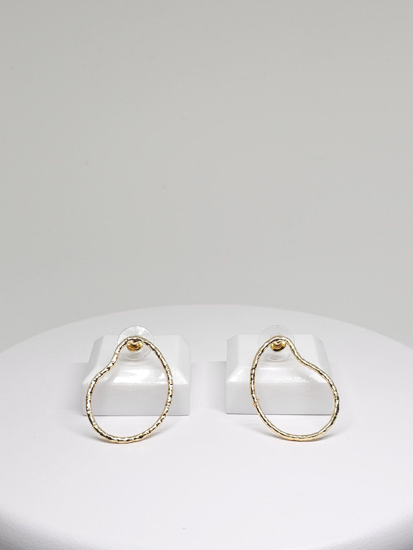 Featuring a sophisticated pear-shaped silhouette, the Simple Brass Pear Hoop Earrings are expertly fashioned from high-quality brass, boasting a durable construction with a radiant, gold-inspired finish