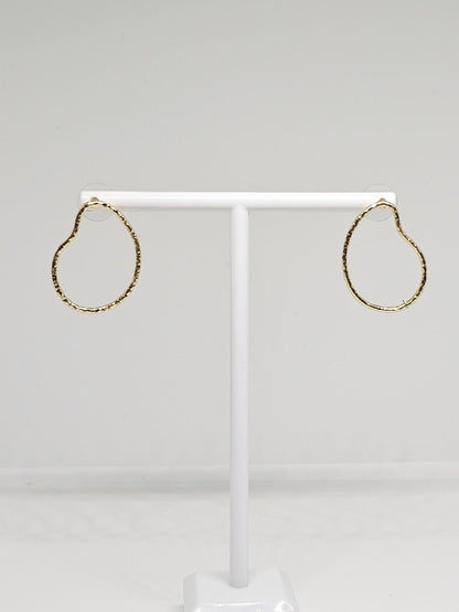 A pair of Simple Brass Pear Hoop Earrings featuring a distinctive pear shape design, crafted from high-quality brass with a luxurious gold-like finish. These elegant earrings are lightweight yet durable