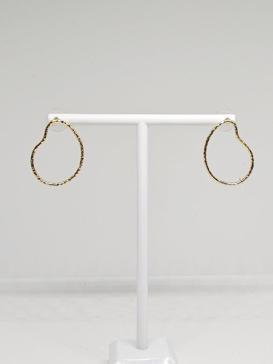 A pair of Simple Brass Pear Hoop Earrings featuring a distinctive pear shape design, crafted from high-quality brass with a luxurious gold-like finish. These elegant earrings are lightweight yet durable