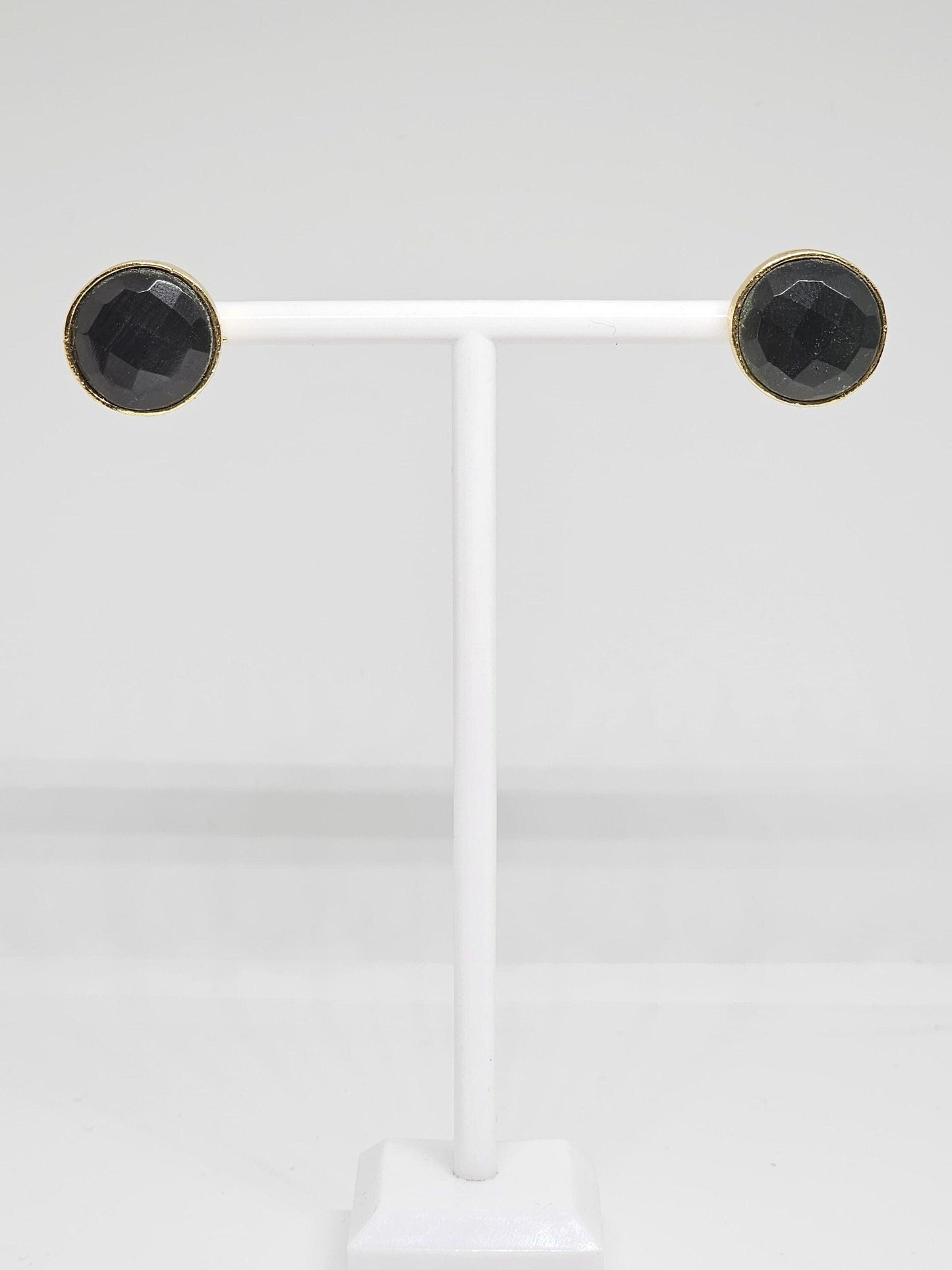 Stylish and versatile black stone brass stud earrings, combining modern design with timeless elegance for a chic look.