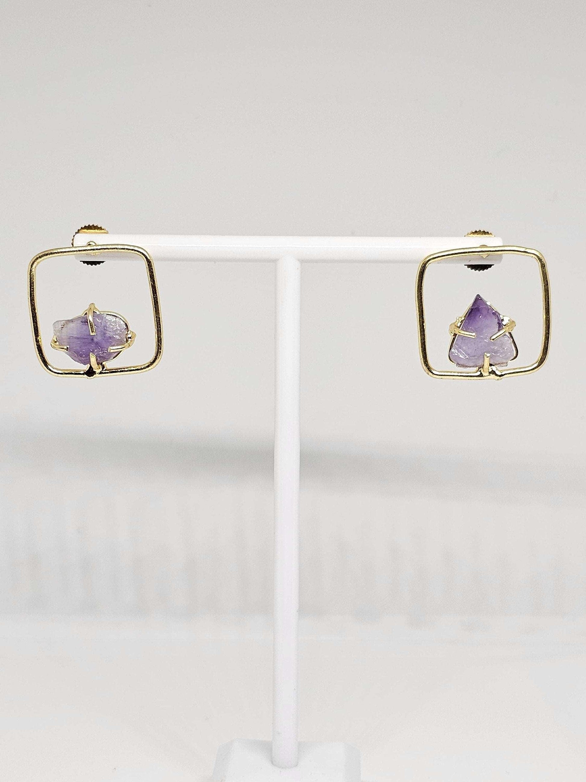 Elegant brass earrings with raw amethyst in a square frame, offering a unique and natural look, perfect for casual and formal wear