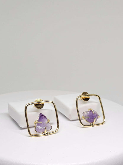 Boho brass earrings featuring raw amethyst stones in a geometric square design, perfect for a unique and stylish accessory.