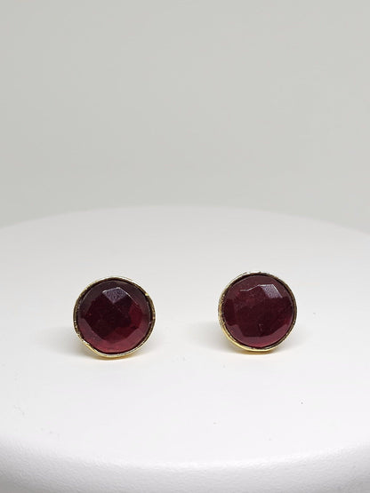 Handcrafted brass stud earrings featuring deep red gemstone, perfect for a sophisticated and elegant look