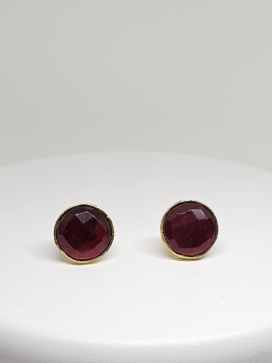 Handcrafted brass stud earrings featuring deep red gemstone, perfect for a sophisticated and elegant look