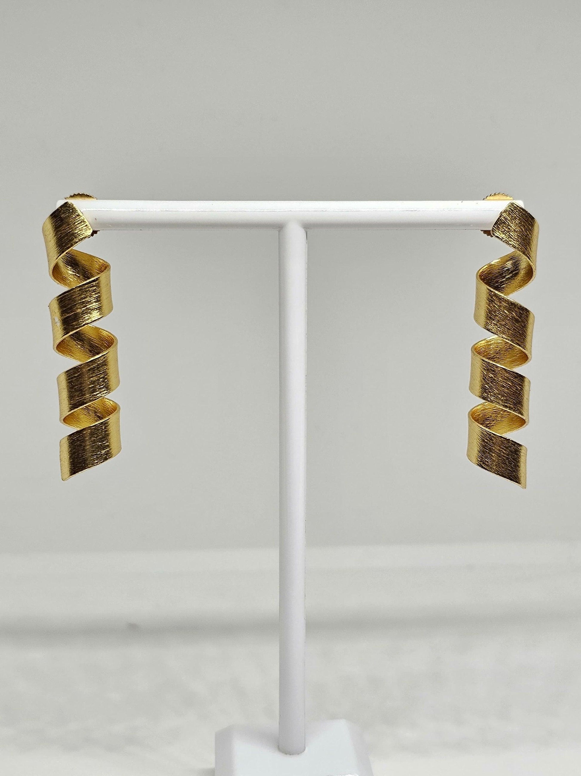 Trendy matte finish spiral drop earrings in gold tone, ideal for parties and elegant occasions