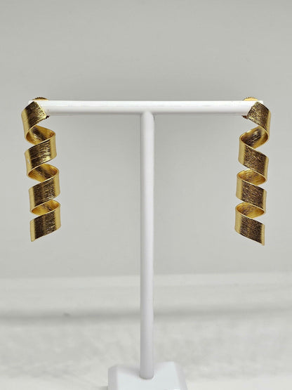 Trendy matte finish spiral drop earrings in gold tone, ideal for parties and elegant occasions