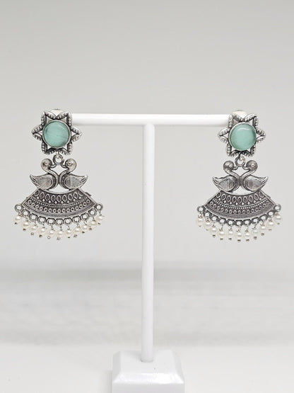 Handmade ethnic earrings featuring duck motifs, star design, and pearl details in oxidized silver