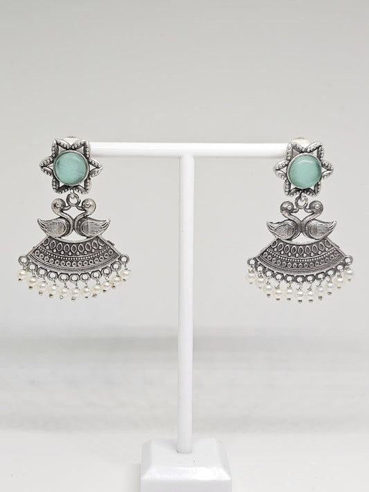 Handmade ethnic earrings featuring duck motifs, star design, and pearl details in oxidized silver
