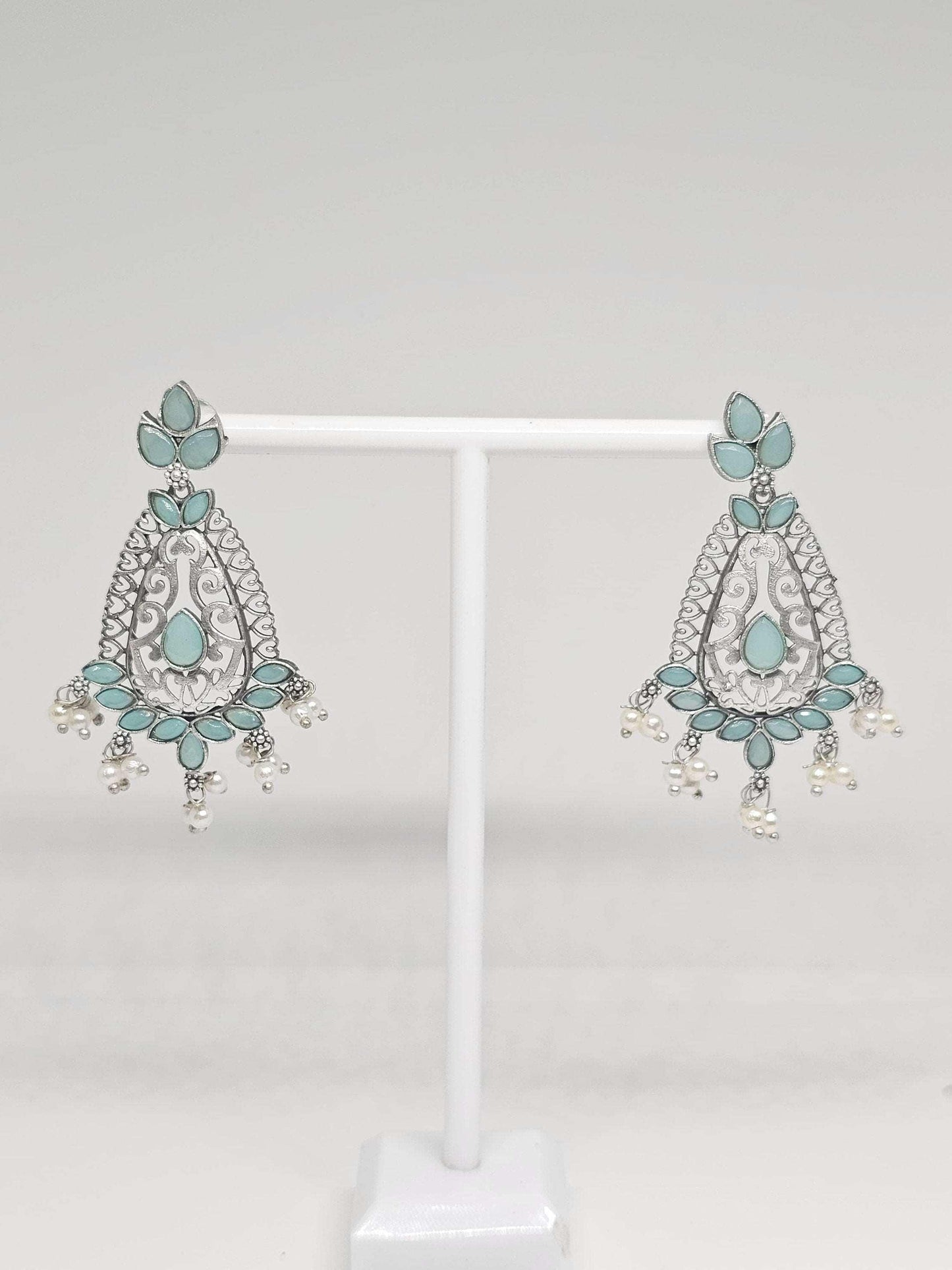 Elegant silver drop earrings with blue turquoise accents and pearl dangles