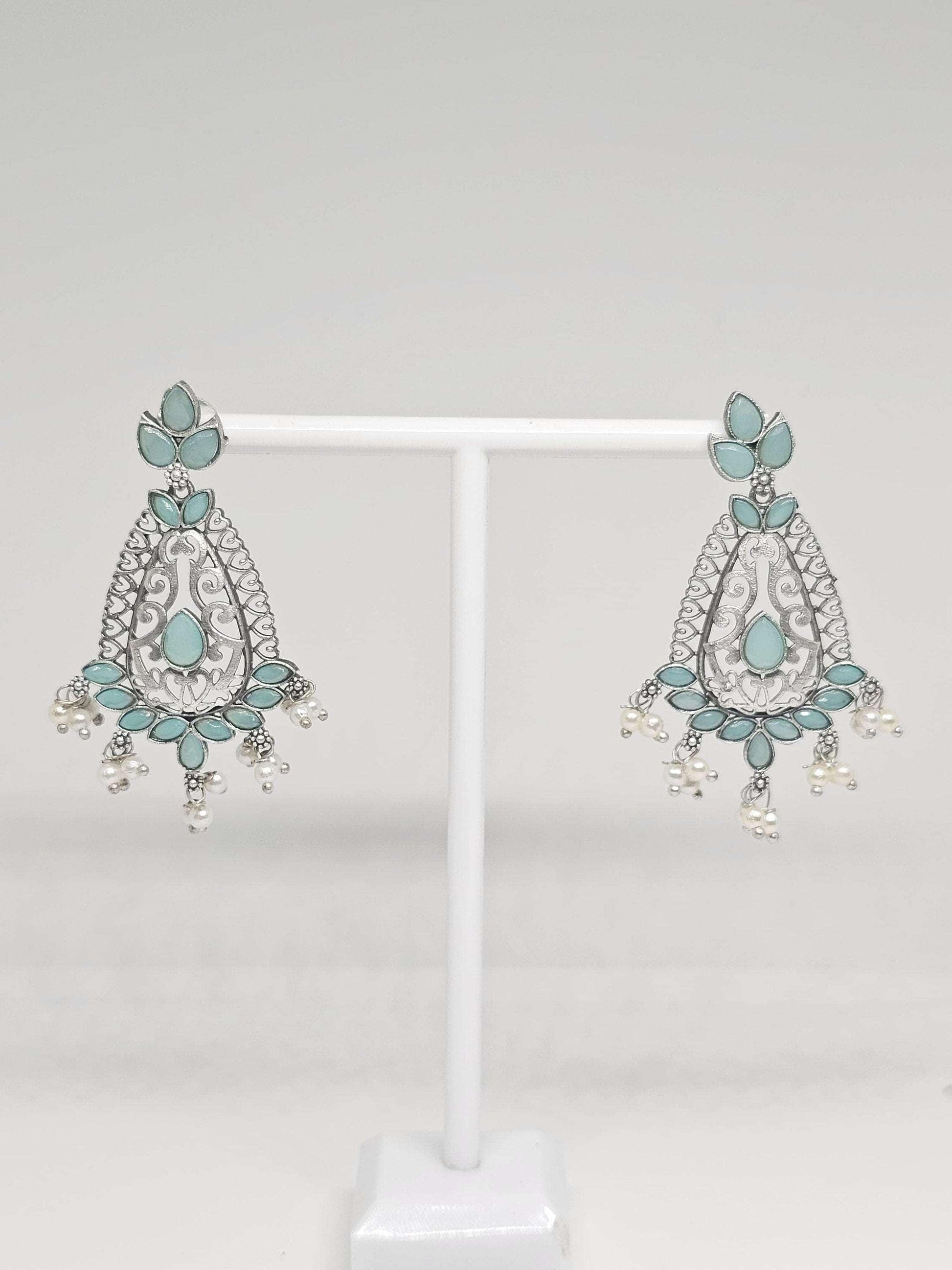 Elegant silver drop earrings with blue turquoise accents and pearl dangles