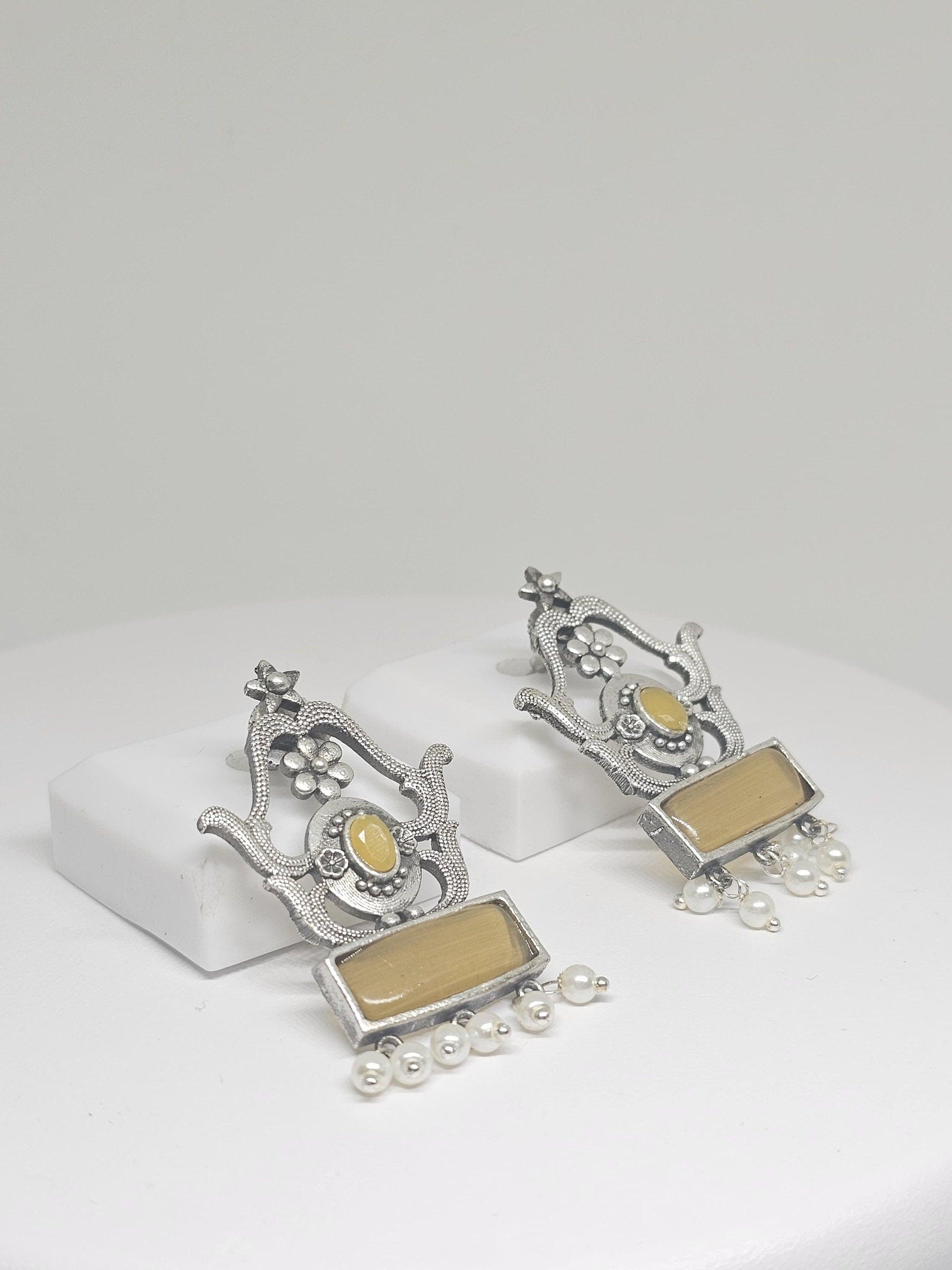 Handmade ethnic Indian dangle earrings with yellow stones and pearl accents, elegant traditional jewelry