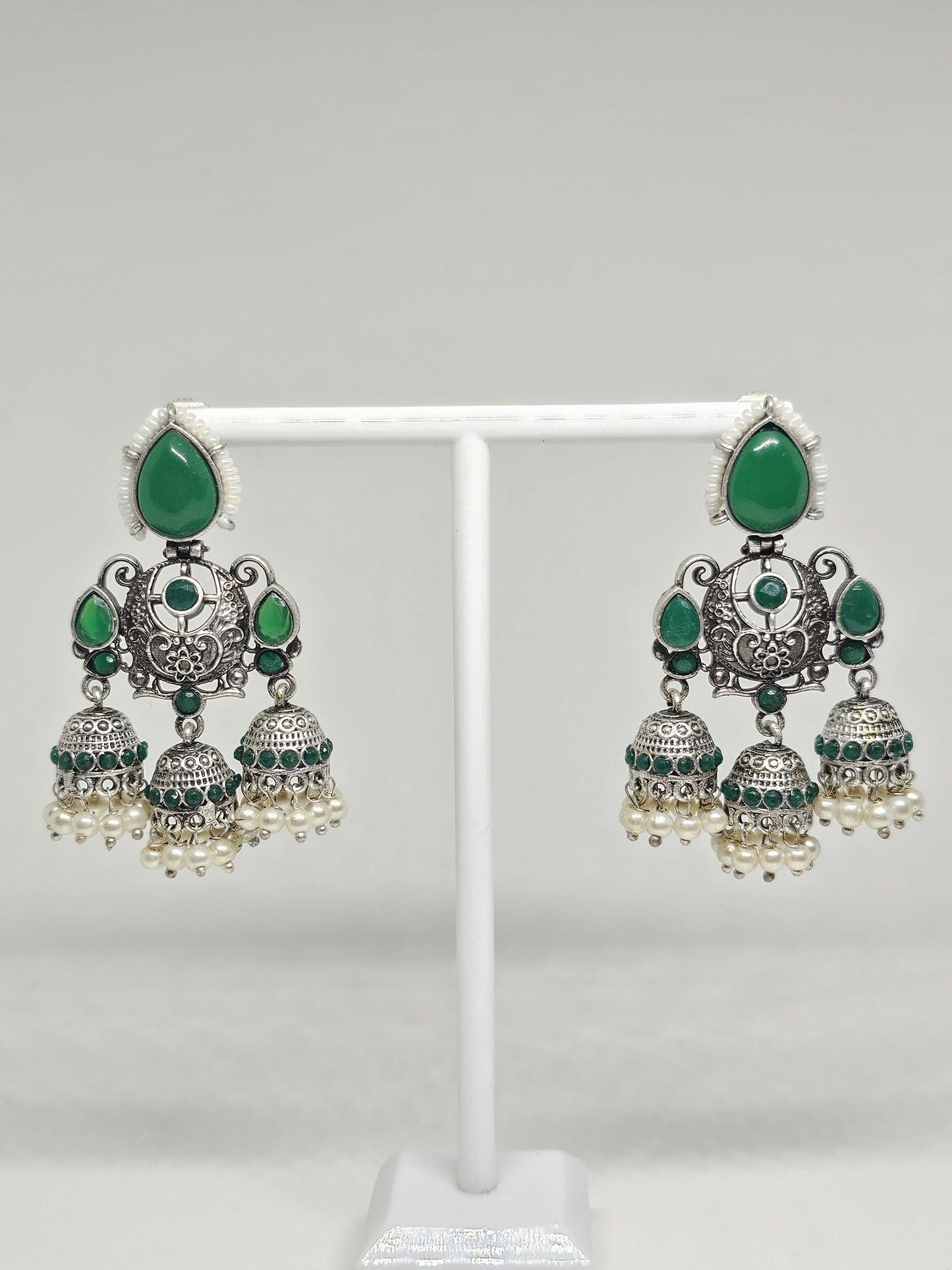 Traditional green and silver jhumka earrings with pearls, ethnic Indian chandbali design