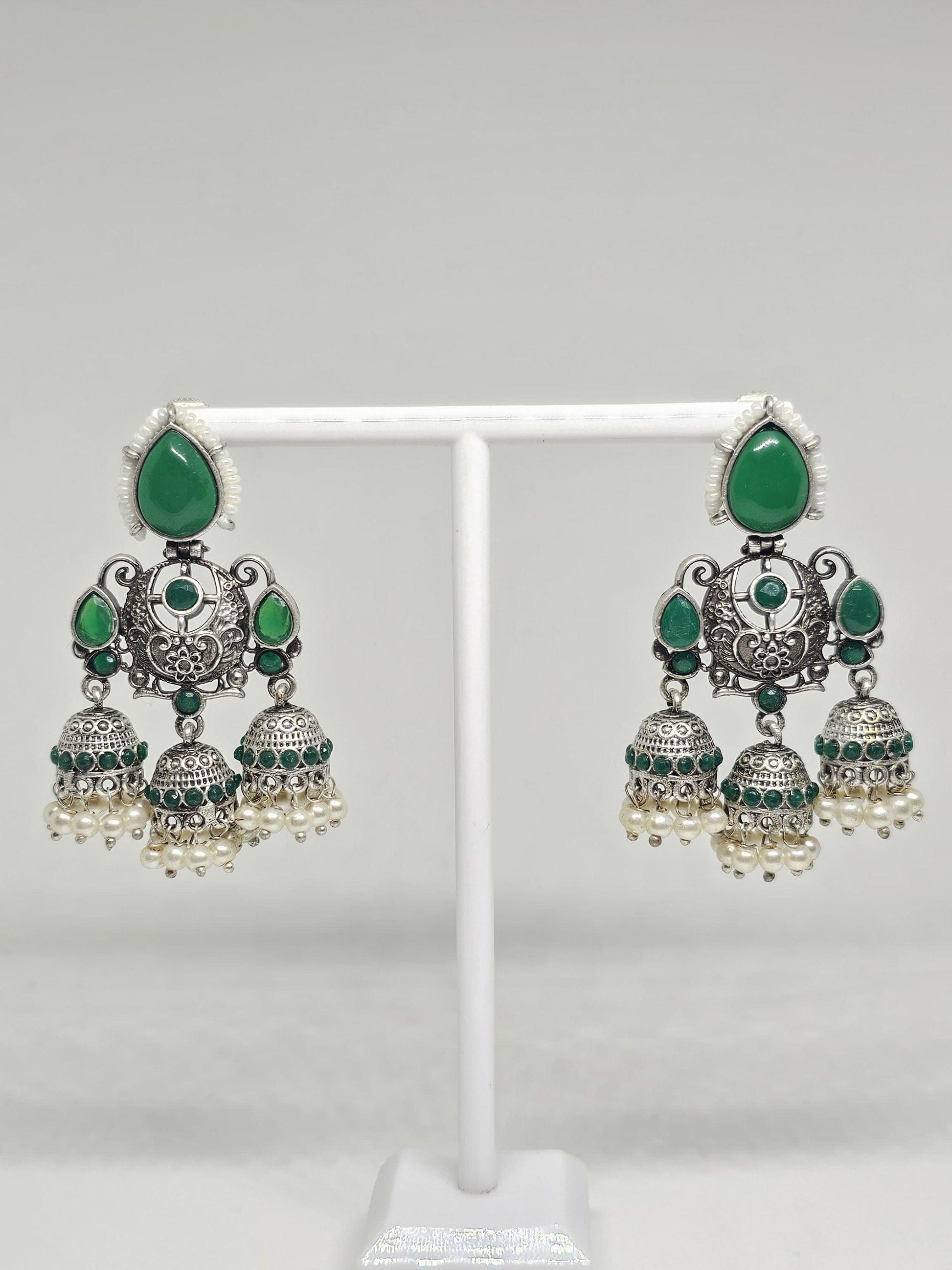 Traditional green and silver jhumka earrings with pearls, ethnic Indian chandbali design