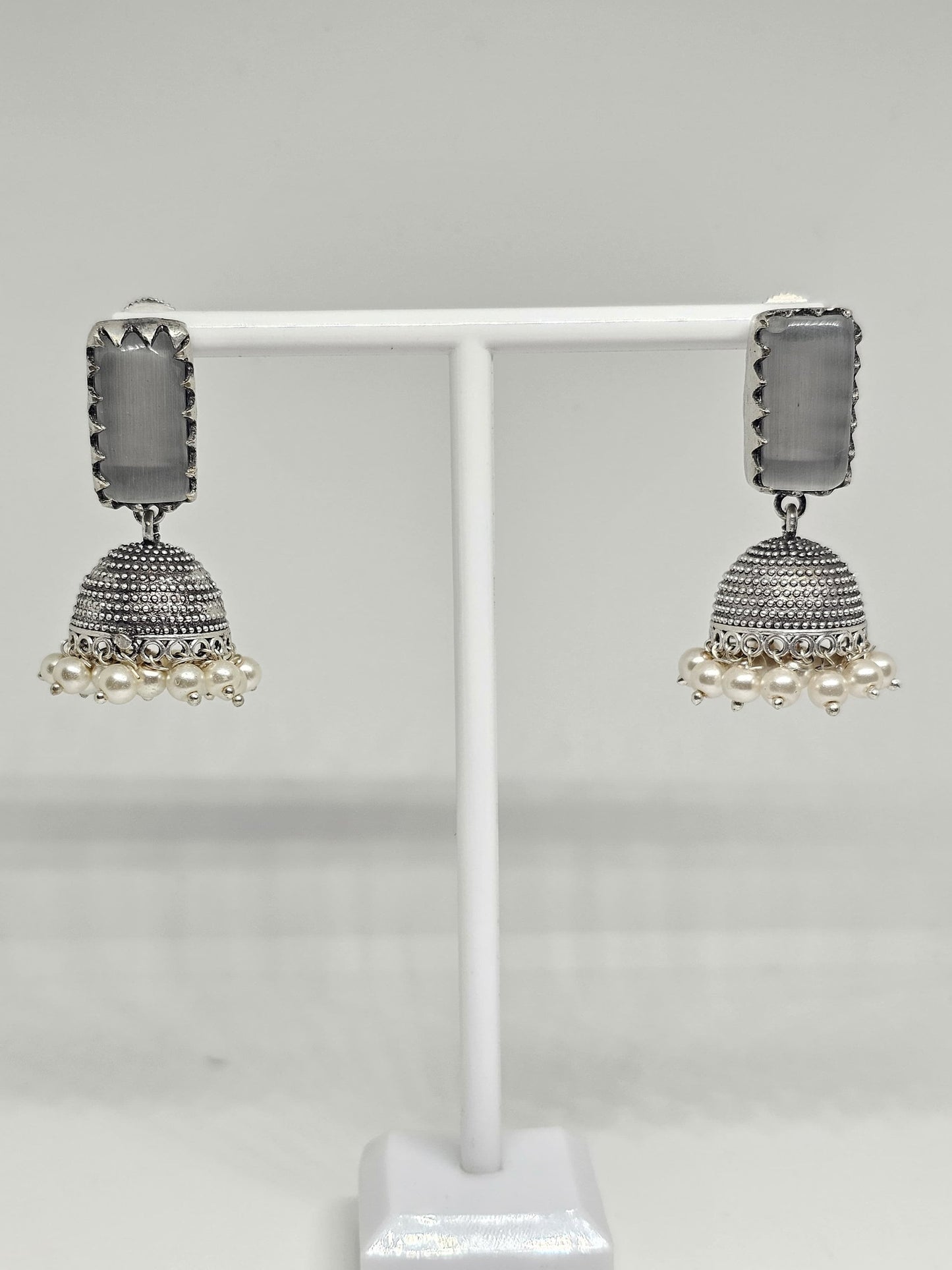 Handcrafted traditional silver jhumka earrings with grey stone and pearl accents