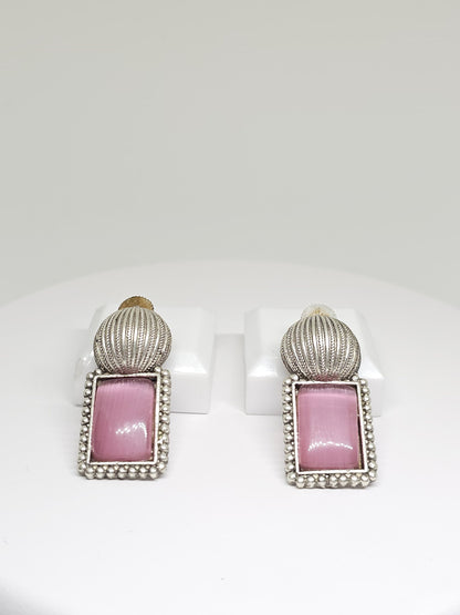 Handcrafted silver earrings featuring rectangular pink Monalisa stone and vintage-inspired detailing