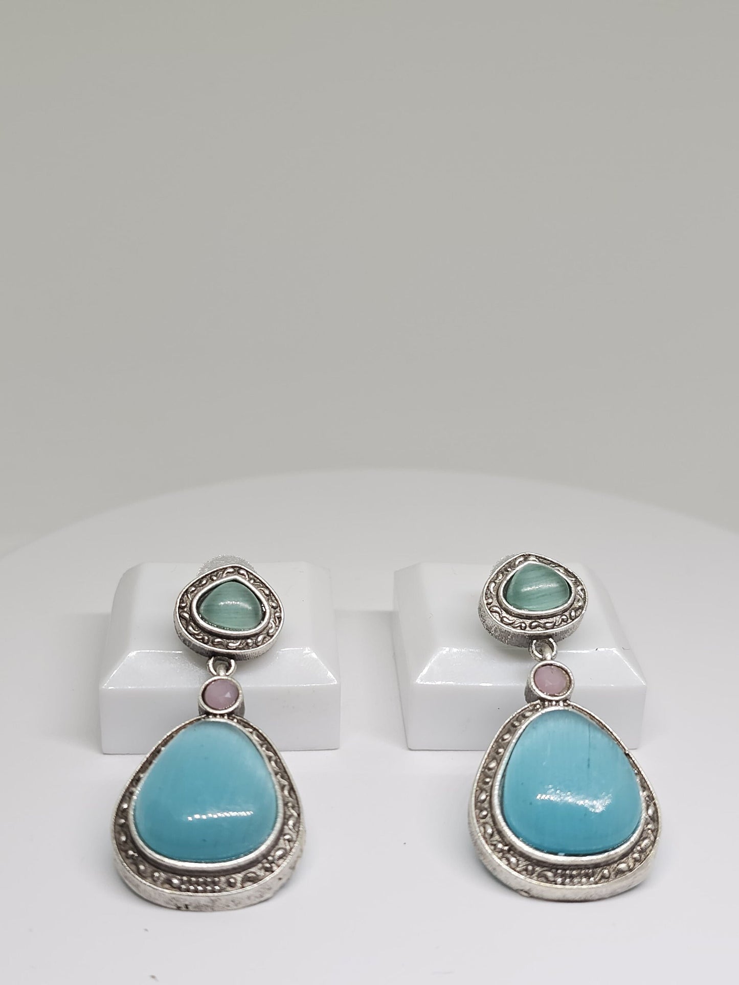 Oxidized silver earrings with aqua blue and light green teardrop stones