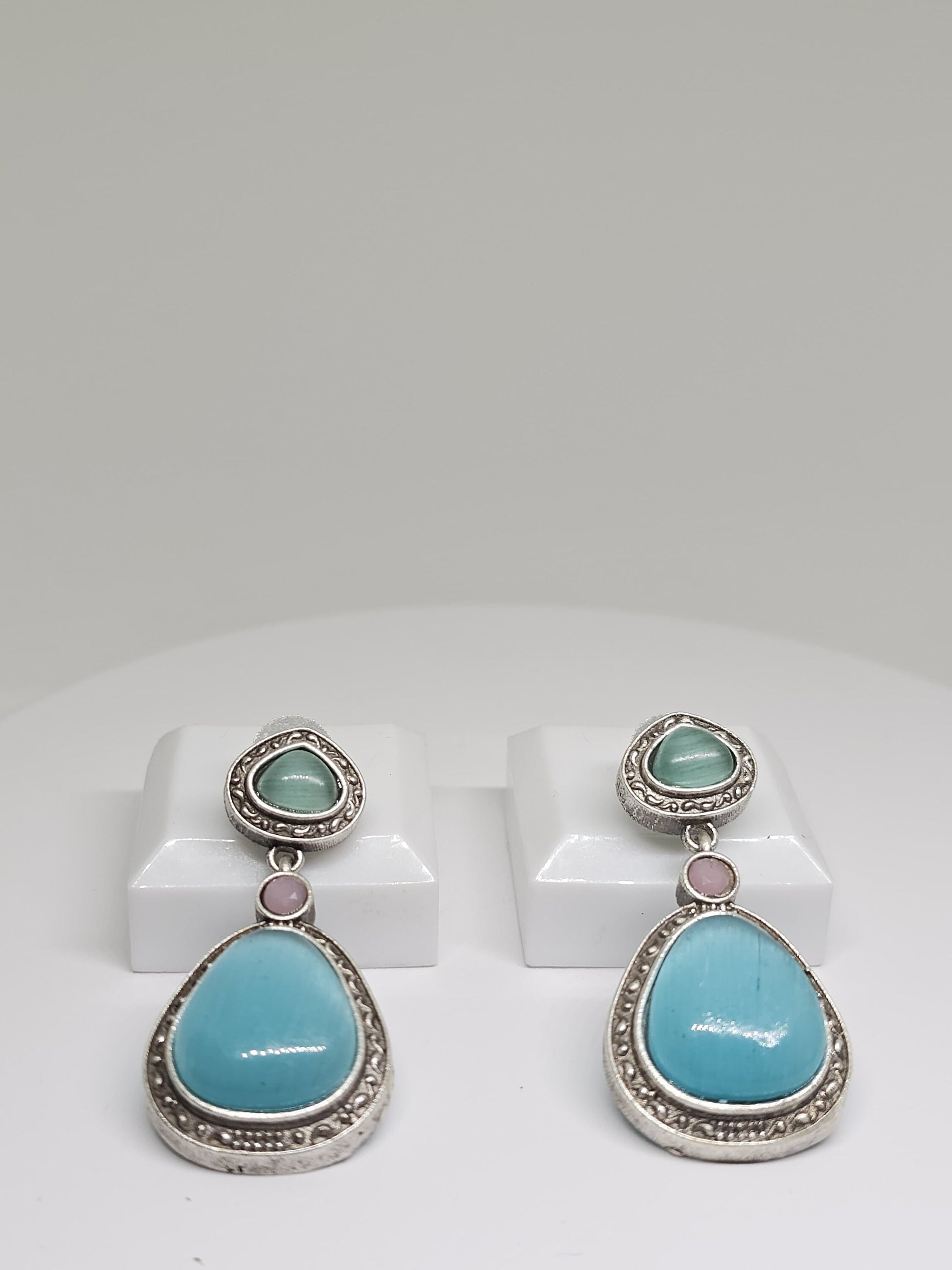 Oxidized silver earrings with aqua blue and light green teardrop stones