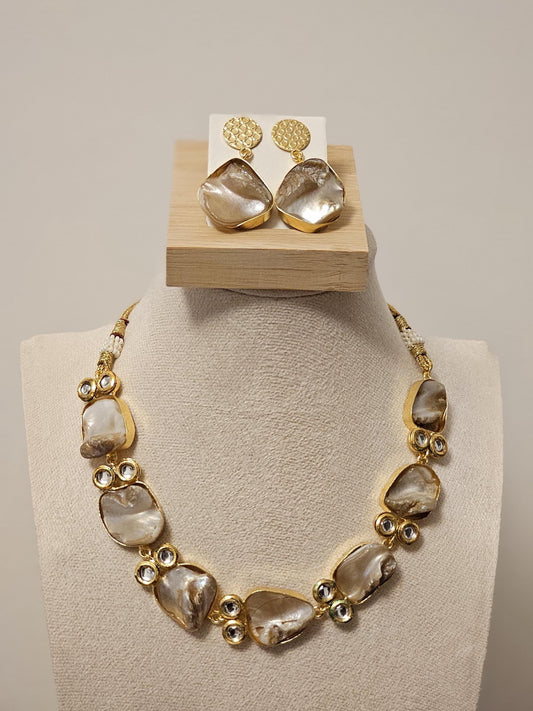 Elegant gold plated necklace and earrings set with natural mother-of-pearl stones and crystal accents, perfect for weddings or gifting