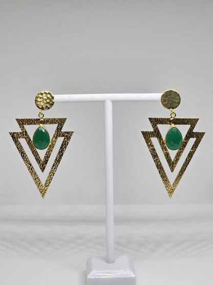 Geometric beaten brass earrings featuring layered textured triangles and a green teardrop-shaped stone, perfect for bohemian and statement looks