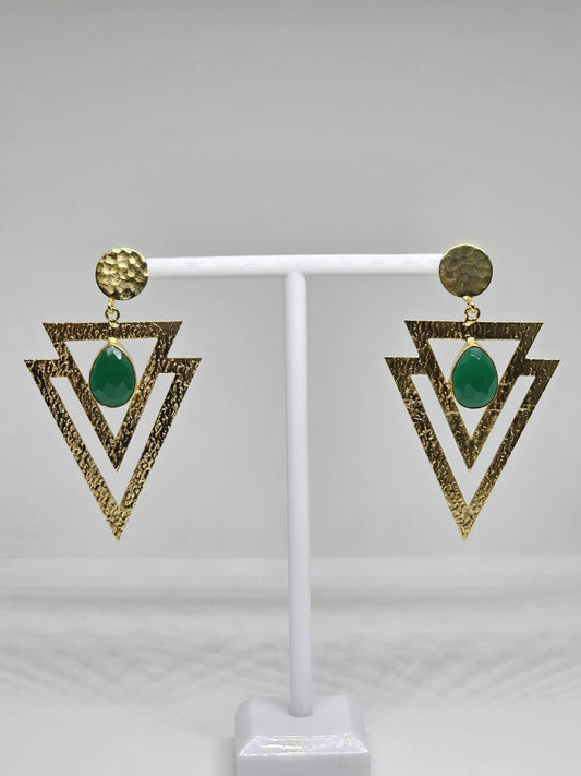 Geometric beaten brass earrings featuring layered textured triangles and a green teardrop-shaped stone, perfect for bohemian and statement looks
