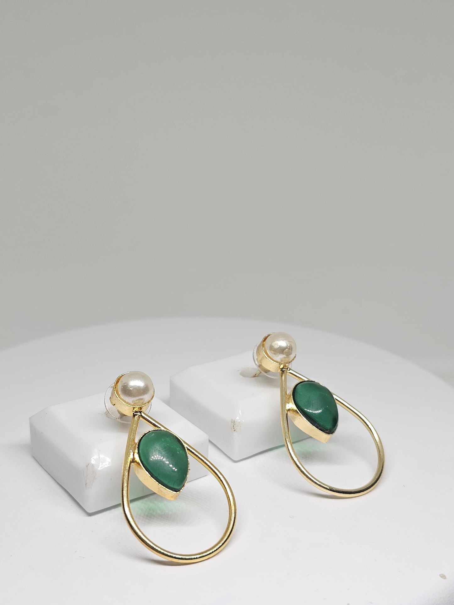 Gold teardrop earrings featuring mother-of-pearl stud and green stone drop, handcrafted for women