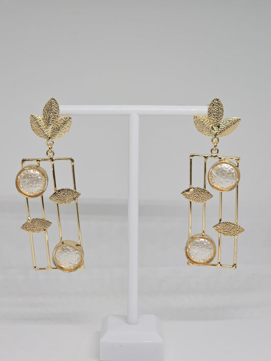 Handmade gold leaf earrings with geometric dangle design and textured circular details for women’s jewelry collection