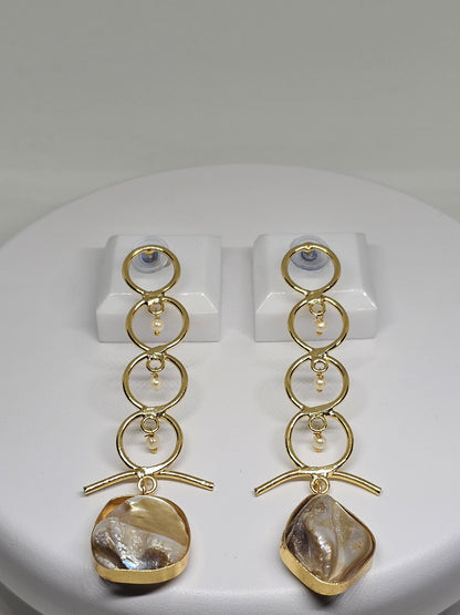 Contemporary geometric earrings in gold featuring a sleek bar design, tiny pearl details, and a lustrous mother-of-pearl stone for a bold yet refined look