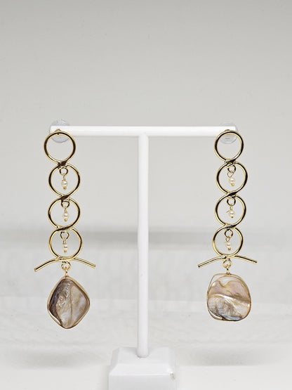Sophisticated gold-tone drop earrings featuring a modern circular design, delicate pearl accents, and a stunning mother-of-pearl centerpiece for an elegant finish