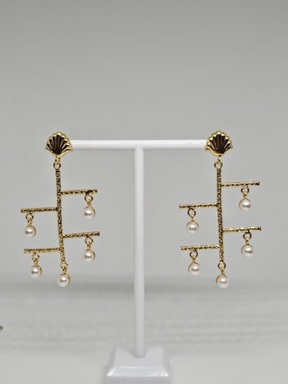 Modern gold-plated dangle earrings with geometric design and faux pearl drops, complemented by shell-inspired studs for elegance