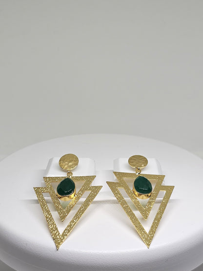 Geometric beaten brass earrings featuring layered textured triangles and a green teardrop-shaped stone, perfect for bohemian and statement looks
