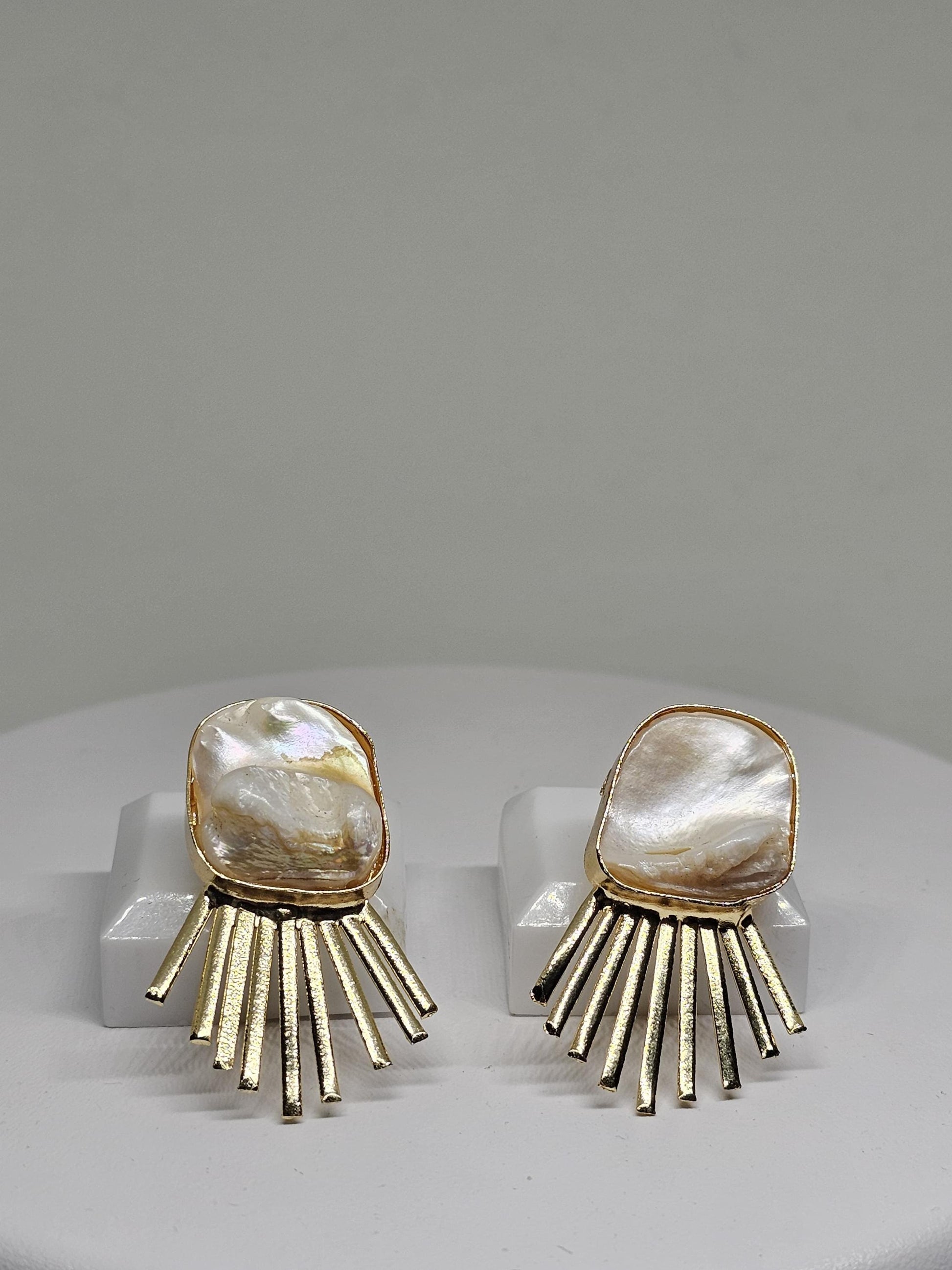 Minimalist pearl-inspired brass earrings featuring a radiant sunray design, perfect for modern and elegant looks