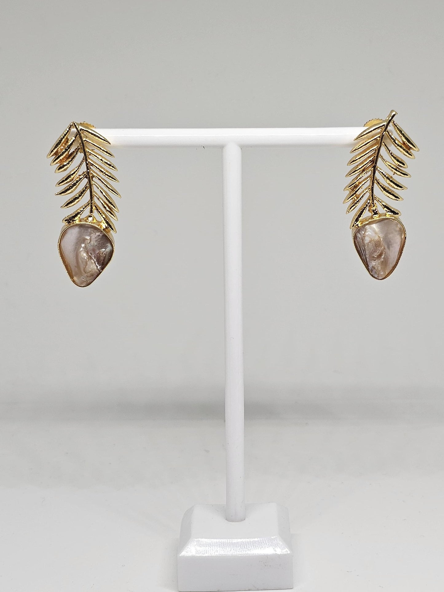 Elegant gold leaf earrings with a natural mother-of-pearl drop, featuring a lightweight and intricate design perfect for women seeking unique handmade jewelry