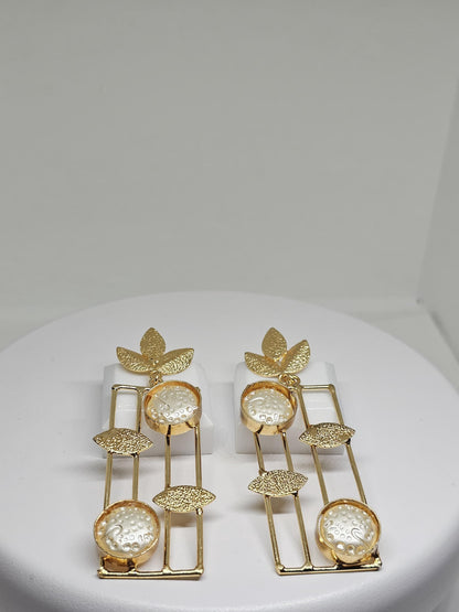 Handmade gold leaf earrings with geometric dangle design and textured circular details for women’s jewelry collection